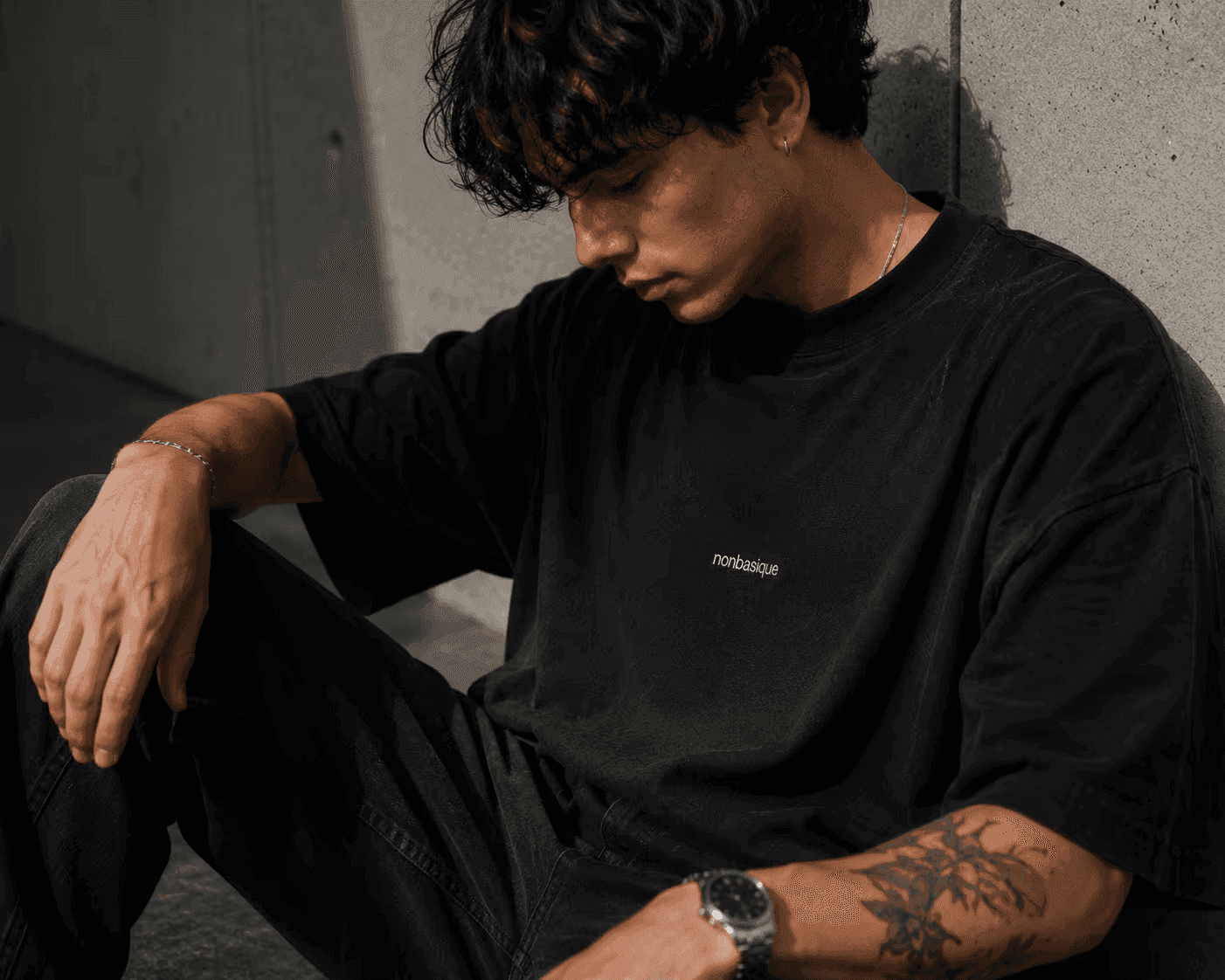 CENTRE 001 in black, on model against concrete